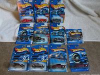 All eleven Hot Wheels cars on cards