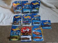 All ten carded Hot Wheels cars displayed