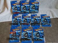 Group shot of all ten sealed Hot Wheels cars laid out in two rows
