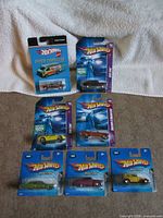 Group shot of all seven carded Hot Wheels Red Lines 2005