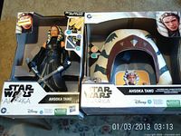 Front of both boxed items showing figure and headpiece