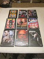 All nine DVD cases laid out 3×3 on table