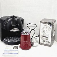 Front view of espresso machine, grinder, boxed cup set, manual visible