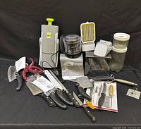 Group shot of all utensils, knives, mini chopper, graters and jars