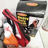 Boxed Racor ic Heavy Duty Hook, Lexol cleaner bottle, red carry bag visible
