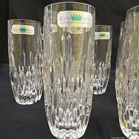 Front view of several glasses showing labels and cut pattern
