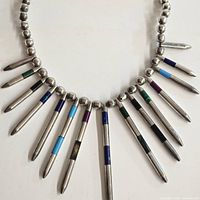 Full view of sterling beaded necklace with multi-color inlay spikes
