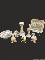 Group overview showing all eight porcelain and ceramic pieces