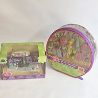 Both packaged Polly Pocket sets side by side