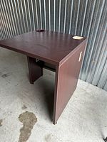 Overall view of desk showing top, side panels, cable grommet