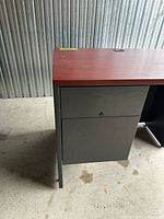 Left side view showing pedestal drawers and top finish