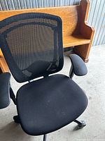 Front angled view showing mesh back, seat, armrests and base