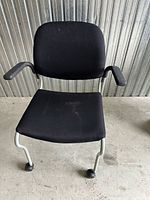 Front view of black rolling office chair