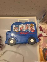 Full view of lunch box bus shape with character graphics