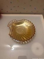 Top view of amber iridescent seashell dish showing full shape