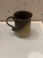 Full view of mug showing brown upper and tan lower glaze