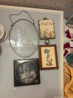 Overview of all four wall art pieces on table