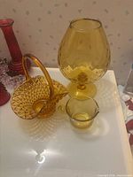 Group shot of all amber glass pieces