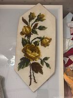 Full view of needlepoint floral panel