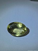 Front view of faceted oval lemon citrine