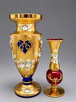 Front view of both vases showing size difference and decorative details