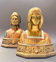 Front three-quarter view of both bust bookends showing Dante and Beatrice detail and finish