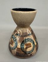 Front view of hourglass-shaped Lapid pottery vase showing glaze pattern