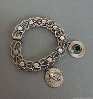 Full view of sterling silver bracelet with two charms attached