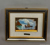 Frontal view of framed seascape painting