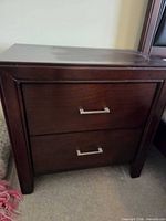 Front view of nightstand showing two drawers and handles