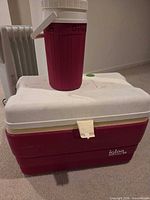 Igloo cooler chest with beverage jug on top