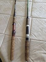 Both fishing rods full length on surface
