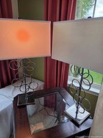 Both lamps on end table showing matching design and working condition