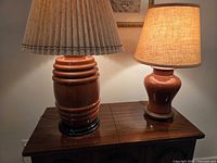 Both terracotta lamps on table showing overall design and shades