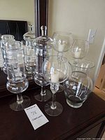 Group view of all six glass pieces on dresser