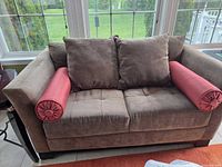 Full view of loveseat with all pillows