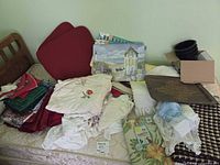Overview of stacked linens on mattress