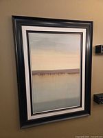 Full view of framed artwork on wall