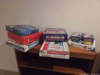 Stack of all boxed games displayed on shelf