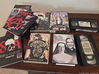 Overview showing all DVDs and VHS tapes on table