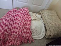 All three blankets laid on floor