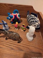 Group shot showing all figurines on wood surface