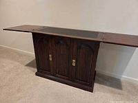 Cabinet with both top leaves extended showing overall form