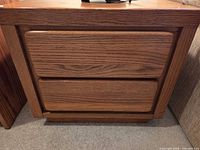 Front view showing two drawers and plinth base