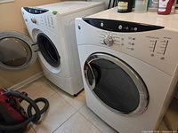 Washer and dryer side by side with pedestals