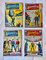 Front view of all four bagged Adventure Comics issues arranged in grid