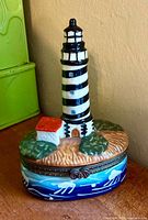 Front view closed porcelain lighthouse trinket box