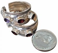 Front view showing stones and rope detail with coin for scale