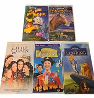 Front view of five VHS tapes showing cover art