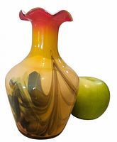 Full view of vase beside apple for scale